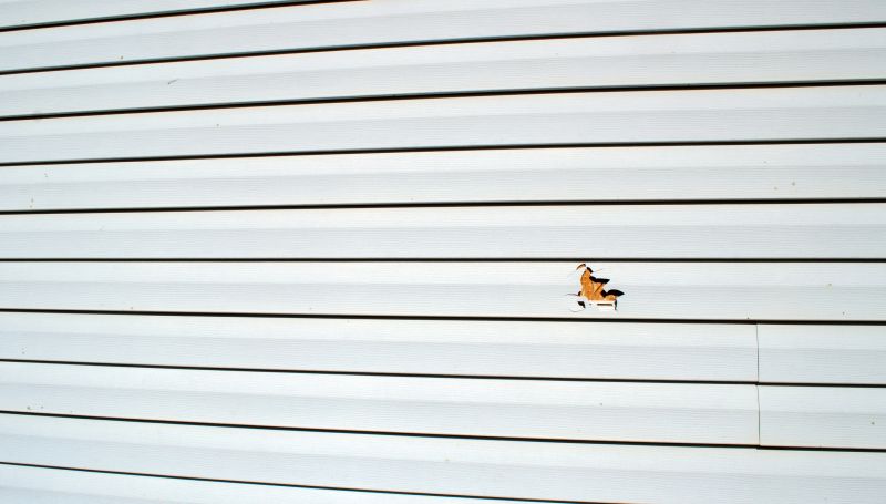 Applying Sealant to Siding